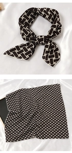 Détail d'un carré de soie avec motif tissé noir et blanc montrant le nœud et la texture