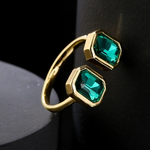 Adjustable 18K gold plated copper ring with two rectangular emerald green zircons