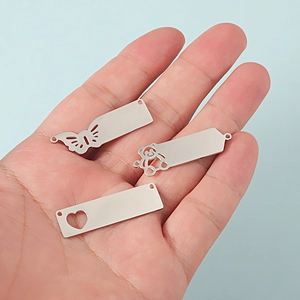 Polished stainless steel pendants with butterfly, bear and heart cutouts for DIY jewelry