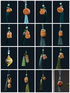 Macro display of assorted hand-carved wooden pendants with silk tassels and bead charms