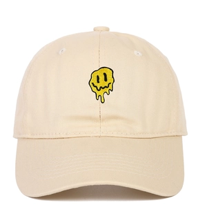 Beige cotton baseball cap featuring a yellow melting smiley face embroidery on the front