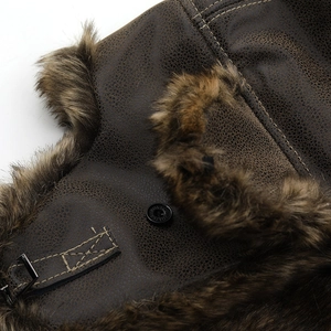 Thickened brown leather trapper hat with warm faux fur lining and chin strap