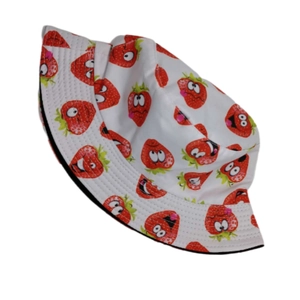 White bucket hat with cartoon strawberry print for outdoor sun protection shown at an angle