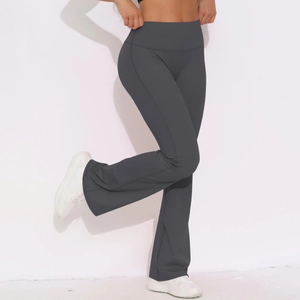 Detail of high-waisted charcoal yoga pants with tummy control and flared leg design