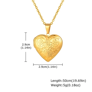Detail view of gold heart locket necklace with engraved floral pattern and size dimensions