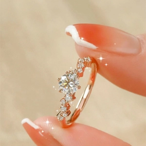 Luxury moissanite engagement ring with rose gold band and sparkling halo stones