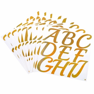 Close-up of 3-inch gold glitter alphabet stickers A to J layered on a white background