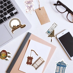 Flat lay of Chinese traditional stickers with lanterns and screens on laptop and phone