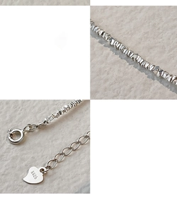 Detail of S925 sterling silver bracelet with heart charm and lobster clasp closure