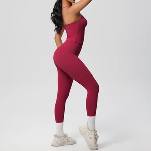 Side view of red high-elasticity yoga set with thin strap tank top and high-waisted leggings