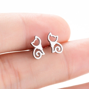 Minimalist silver cat ear studs featuring a cute hollow silhouette and spiral tail