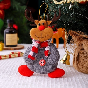 Detail of felt Christmas reindeer ornament with snowflake button and knitted scarf decor
