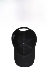 Internal view showing reinforced seams, ventilation holes and adjustable buckle of black cap