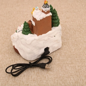 Detail showing the USB power cable connected to the Christmas gingerbread train decor