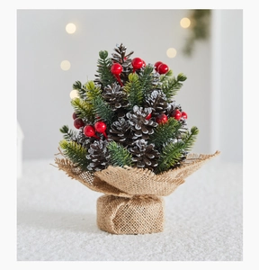 Miniature pinecone Christmas tree with red berries, snow finish and burlap base