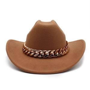 Detail of vintage camel wool fedora hat featuring a chunky decorative gold metal chain