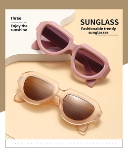 Detail of pink and nude irregular thick-frame sunglasses with polarized lenses