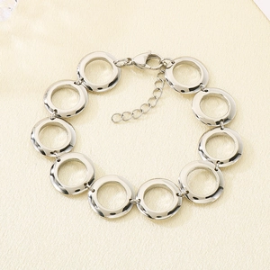 Polished silver circular link bracelet with adjustable chain and lobster clasp closure