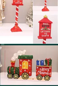 Illuminated Christmas Santa mailbox and festive holiday train display with LED lighting