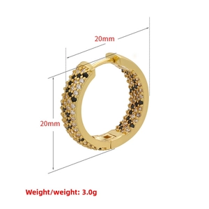 Detail view of 20mm gold-plated hoop earring with black and white zircon leopard pattern