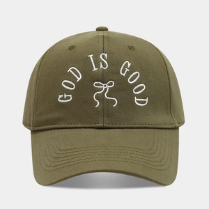 Detail view of olive green baseball cap with white bow and GOD IS GOOD embroidery