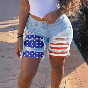 Women's light blue ripped denim shorts with American flag patch and high waist style