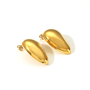 Detailed view of polished 18k gold plated water drop earrings with a mirror finish