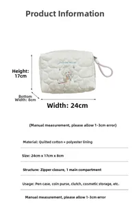 Detail of white quilted cotton pouch with rabbit embroidery and dimensions 24x17x8cm