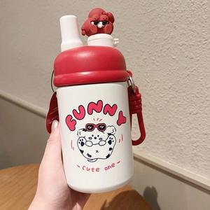 Detail of cute white vacuum flask with red 3D cartoon figure lid and adjustable strap