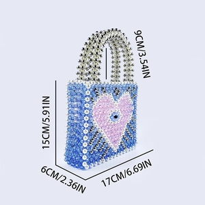 Detail shot of the beaded handbag with evil eye heart pattern and size measurements