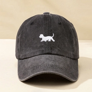 Vintage washed charcoal grey baseball cap featuring a white dog embroidery and adjustable strap