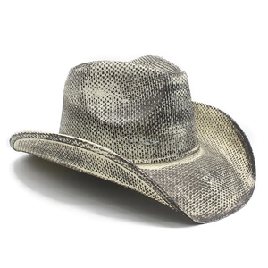 Macro detail of snakeskin pattern on woven straw cowboy hat with wide brim