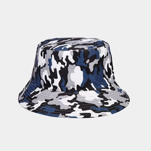 Detailed view of durable camouflage canvas fabric and stitching on a reversible bucket hat