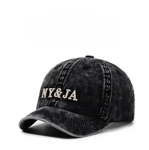 Detail of vintage washed black denim baseball cap with 3D NY&JA embroidery