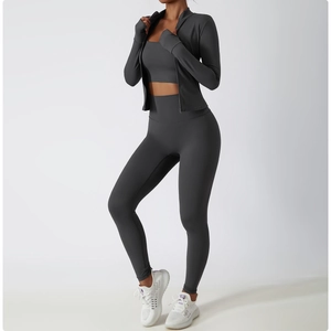 Detail view of charcoal grey three-piece yoga set with seamless jacket and leggings