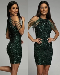 Detail of sequined bodycon dress showing emerald green beads and fringe on shoulder