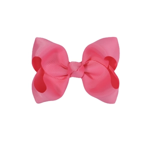 Bright pink 4.13 inch ribbed fabric bow hair clip for girls on white background