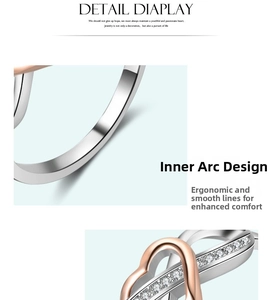 Detailed macro view of the inner arc design on a two-tone infinity heart diamond ring