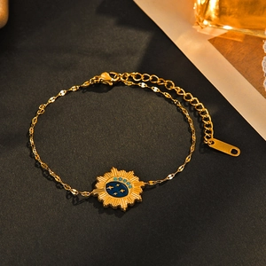 14K gold-plated stainless steel bracelet with a navy blue celestial sun moon pendant