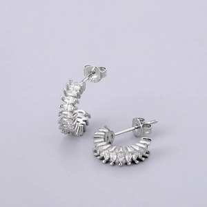 Macro view of S925 sterling silver C-shaped earrings with marquise-cut zircon stones