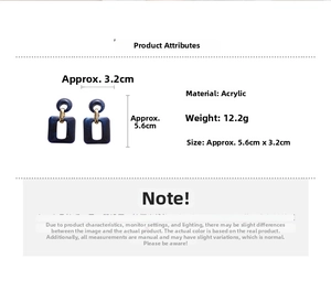 Detail of dark blue acrylic rectangle earrings with marble pattern and 5.6cm size