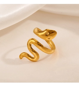 Macro detail of 18K gold plated stainless steel snake ring on warm silk background