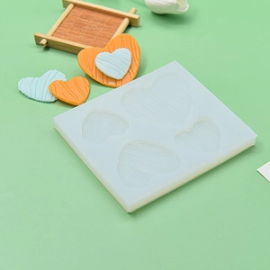 4-cavity heart silicone cake mold with striped texture for Valentine baking gifts