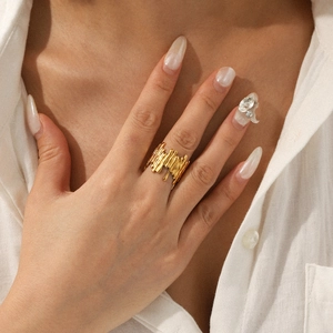 Irregular 18K gold plated stainless steel open ring with liquid metal lava texture