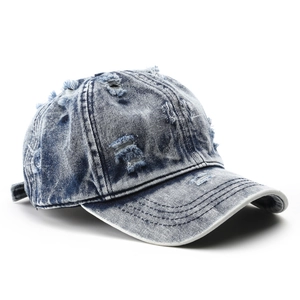 Distressed washed light blue denim baseball cap with vintage frayed holes and plain design