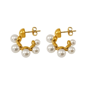 Detail of French vintage C-shaped gold stainless steel earrings with five white pearls