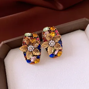 Vintage gold flower earrings with colorful rhinestones and pearls in a premium jewelry box