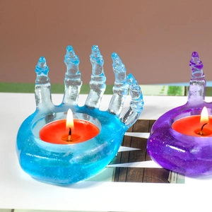 Ghost hand silicone candle holder mold with blue and purple resin skeletons