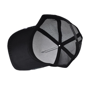 Detailed view of black trucker hat breathable mesh back and adjustable snapback closure