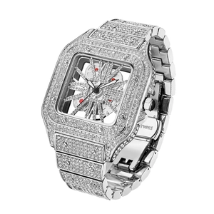Close-up of luxury iced-out square watch with skeleton dial and silver diamond stones